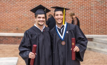 Students display their diplomas following Cumberlands graduation. 