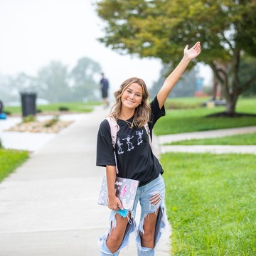 Student poses for a photo on campus