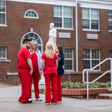 Nursing students having a conversation on campus
