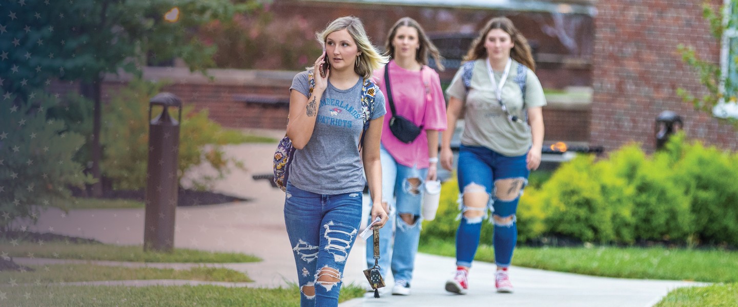 Students walk across campus near Grace Crum on the first day of class