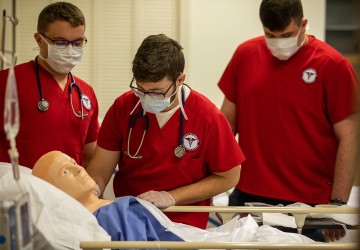 Nursing students work through an examination. 