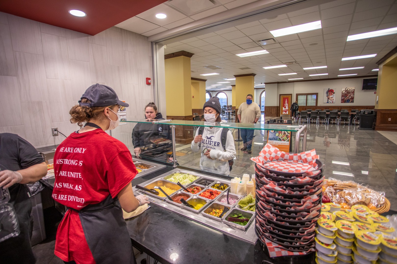 Behind the counter of a small cafe on campus