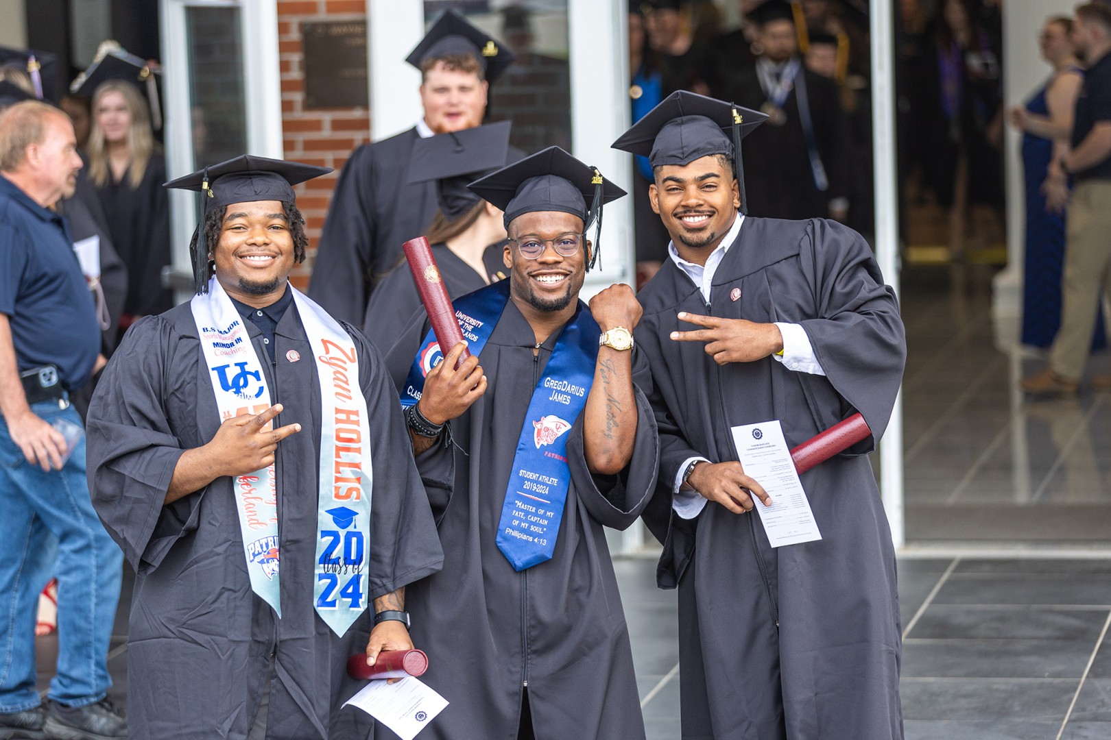 Three students celebrate their graduation at University of the Cumberlands.