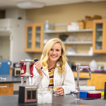 A biologist in a classroom
