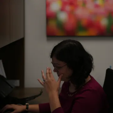 Overworked sitting at a desk