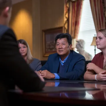 A group of people seated at a business table