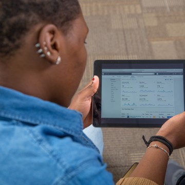 A woman looking at a tablet