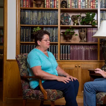 A counselor speaking with a student