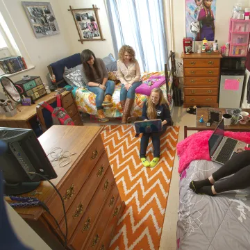 Students sitting in a dorm room