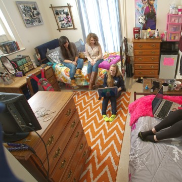Students sitting in a dorm room