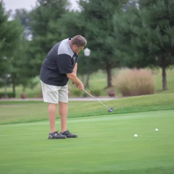 A golfer putting