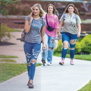 Students walk across campus near Grace Crum on the first day of class