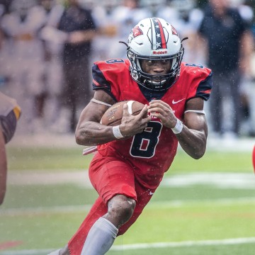A Cumberlands running back follows his blockers on a play. 