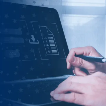 Information Security Specialist Working on Laptop