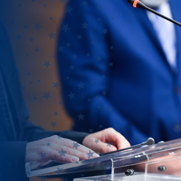 Person Speaking at Podium