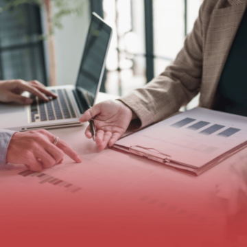 Human Service Worker with Laptop and Charts