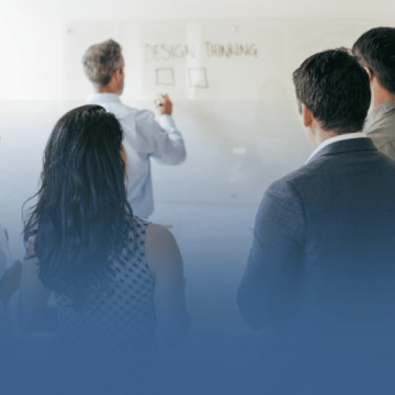 Business Professionals Taking Notes in Meeting