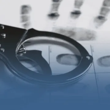 Handcuffs on Fingerprinted Paper