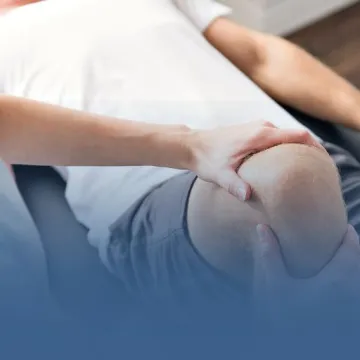 Physical Therapist Working on Patient Knee