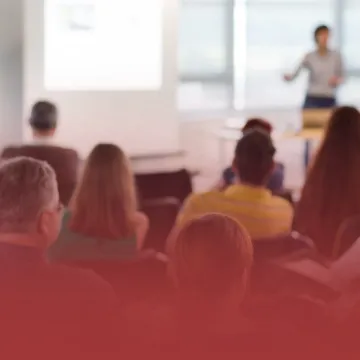 Educator at the Front of a Classroom Lecturing