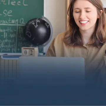 Teacher Working on Laptop