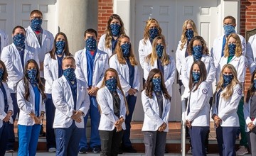 Students wearing physician coats