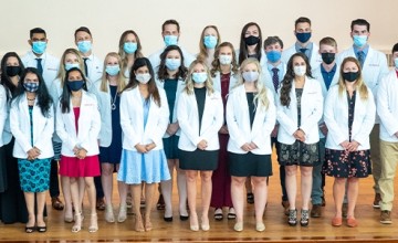 Students wearing physician coats