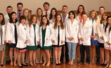 Students wearing physician coats