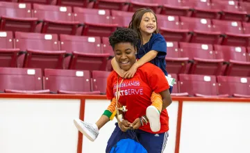 A Cumberlands student spends time with a local child during Shoes 4 the Soul