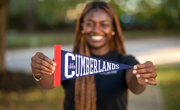 A Cumberlands student shows off the school's pennant 