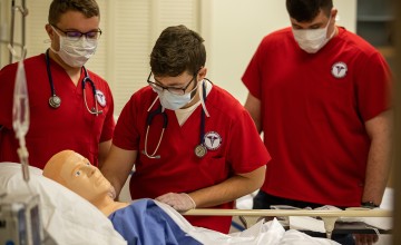 Nursing students work through an examination. 
