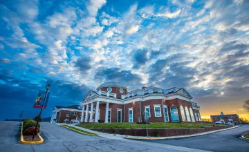 Sun rises over the campus science center. 
