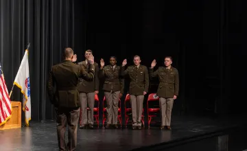 ROTC cadets in the class of 2024 take the Oath of Office commissioning them as 2nd lieutenants in the U.S. Army.