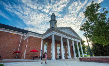 A student walks to class near the Rollins athletics center. 