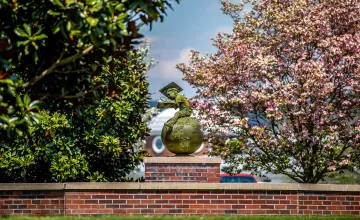 The globe statue in front of the education building. 