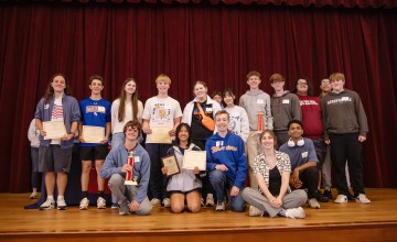 A group of students from the local community presented with a math award. 