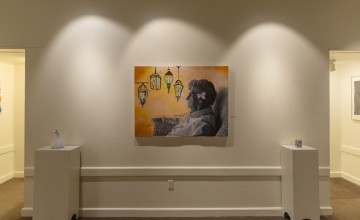 A student painting of an older woman inside the Cumberlands art gallery. 