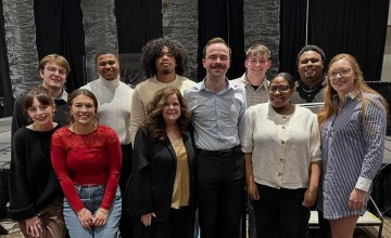 Lisa Bartram stands with a group of students after being recognized by the Association for the Promotion of Campus Activities. 