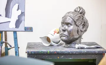A artistic statue of a woman's head is displayed in Cumberlands art studio. 