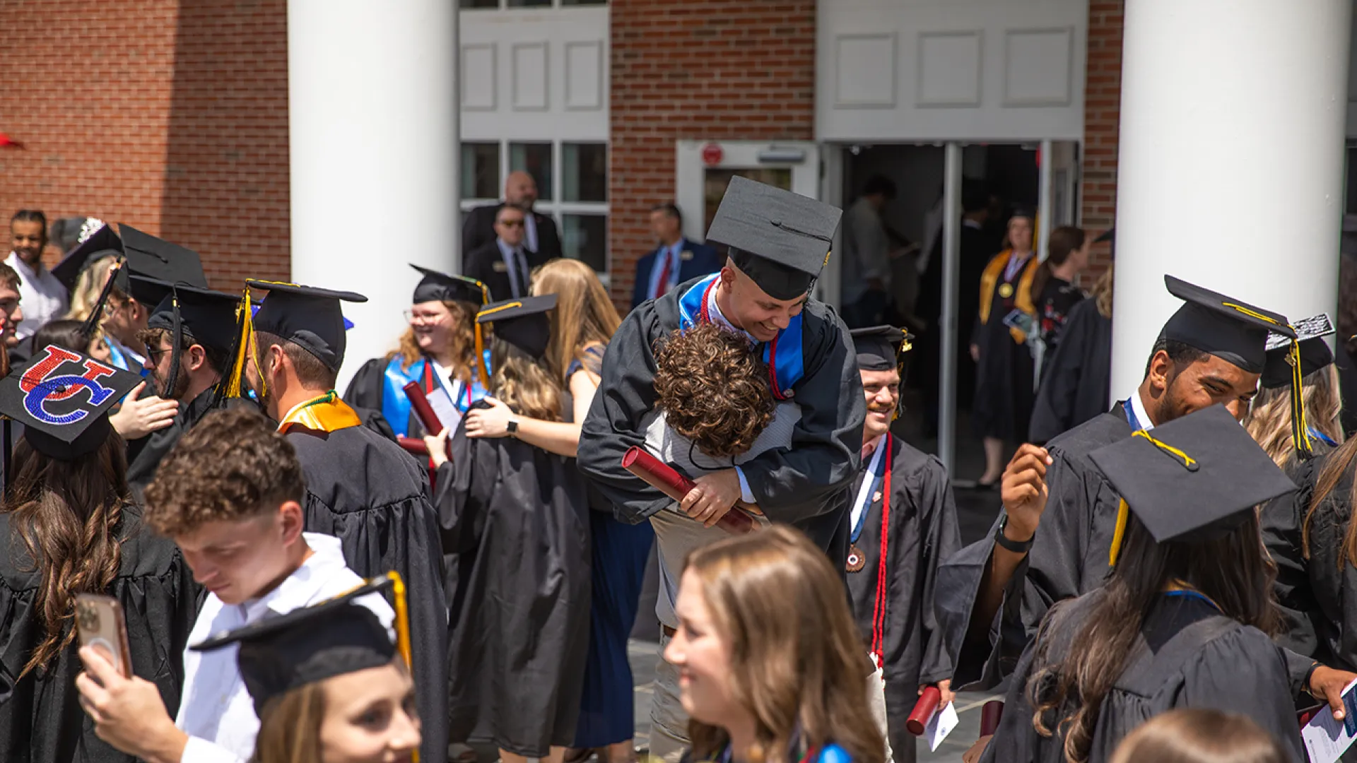 Graduates celebrate following commencement services