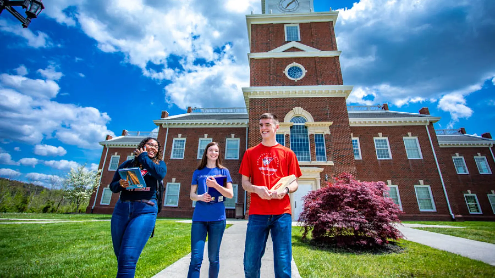 Students walk outside Hutton School of Business