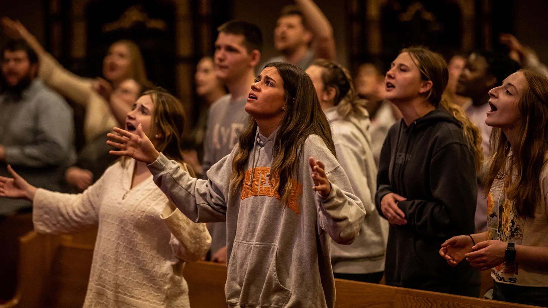 Student sing during a worship event