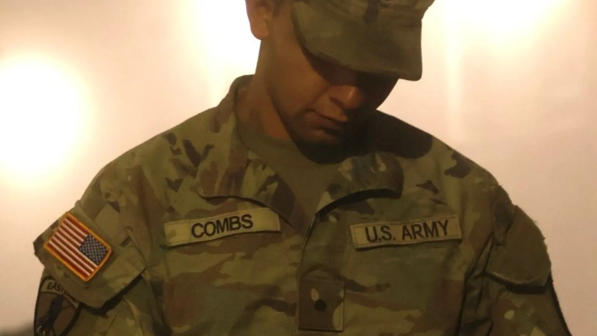 An ROTC student works on an ipad. 