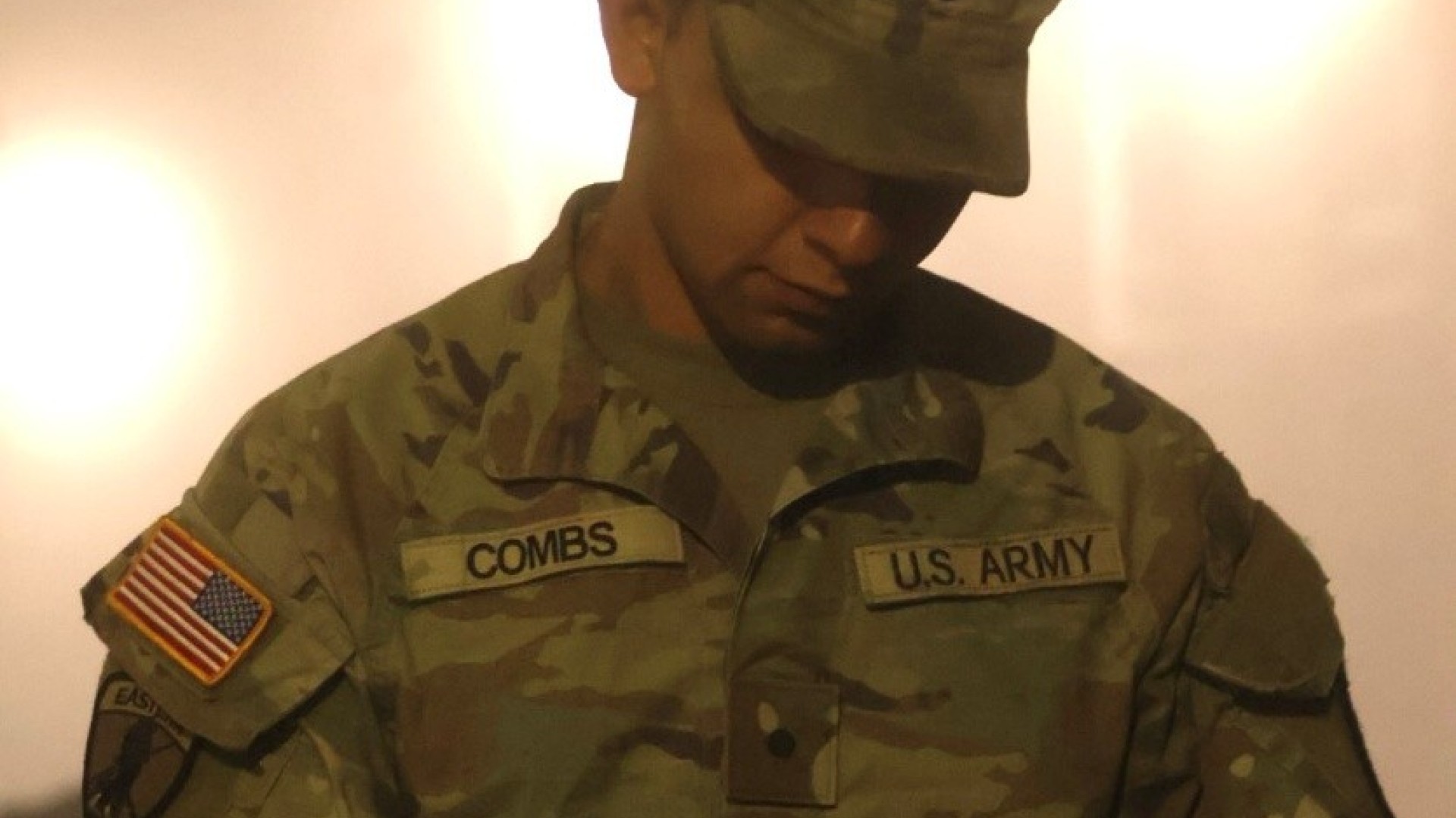 An ROTC student works on an ipad. 