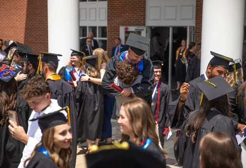 Graduates celebrate following commencement services