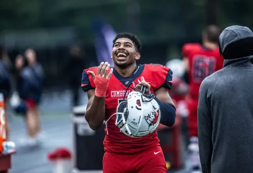 A football celebrates following a win