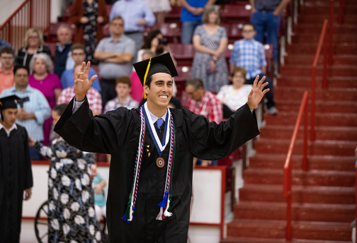 Young man in graduation cap and gown