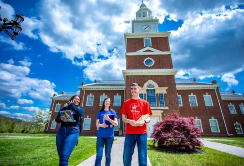 Students walk outside Hutton School of Business