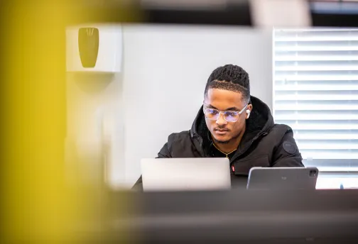 A student using a laptop