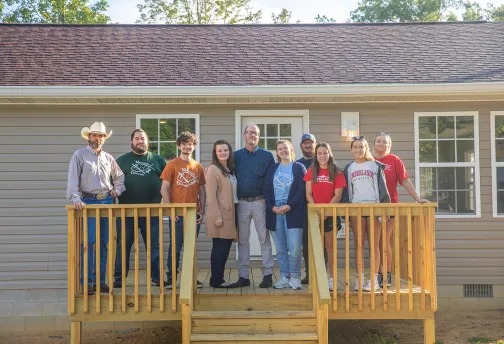A local family receives the keys to a new home